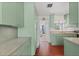 Well-maintained kitchen features ample cabinet space, countertops, and hardwood flooring at 4701 W Wyoming Ave, Tampa, FL 33616