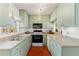 Efficient kitchen features a full suite of appliances, ample counter space, and cabinet storage at 4701 W Wyoming Ave, Tampa, FL 33616