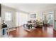 Cozy living room showcasing wood floors, natural light, and an easy transition to the dining area at 4701 W Wyoming Ave, Tampa, FL 33616