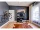 Office/bedroom with dark grey walls and light wood floors at 508 N Walker St, Plant City, FL 33563