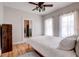 Bedroom features hardwood floors, ceiling fan, and a window providing natural light at 508 N Walker St, Plant City, FL 33563
