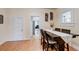 Dining room with hardwood floors, dark wood table and shelving for wine storage at 508 N Walker St, Plant City, FL 33563