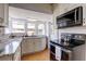 Kitchen with granite countertops, stainless appliances and hardwood floors at 508 N Walker St, Plant City, FL 33563