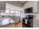 Kitchen with granite countertops, stainless appliances and hardwood floors at 508 N Walker St, Plant City, FL 33563