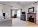 Spacious living room featuring hardwood floors, fireplace, and stylish decor at 508 N Walker St, Plant City, FL 33563