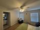 Bedroom with hardwood floors, natural light and an attached bathroom at 527 Glenn Cross Dr, Ruskin, FL 33570