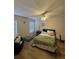 Bright bedroom featuring hardwood floors, ceiling fan and natural light at 527 Glenn Cross Dr, Ruskin, FL 33570