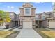 Inviting townhome featuring a two-car garage and neutral color scheme at 527 Glenn Cross Dr, Ruskin, FL 33570