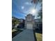 This home features a two-car garage, manicured lawn, and a neutral, modern exterior at 527 Glenn Cross Dr, Ruskin, FL 33570