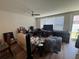 Comfortable living room with ceiling fan, natural light and hardwood flooring at 527 Glenn Cross Dr, Ruskin, FL 33570