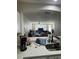 Open-concept living room with natural light flowing from attached dining area with table and chairs at 527 Glenn Cross Dr, Ruskin, FL 33570