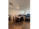 Attached dining area featuring a wooden table and chairs, hardwood flooring and natural light at 527 Glenn Cross Dr, Ruskin, FL 33570