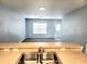 View from the kitchen of the living room and the front entry at 5303 Terraza Ct, Temple Terrace, FL 33617