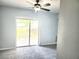 Light and airy living room features a sliding glass door to the outside at 5303 Terraza Ct, Temple Terrace, FL 33617
