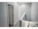 Upstairs hallway with new carpeting and light blue paint at 5303 Terraza Ct, Temple Terrace, FL 33617