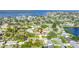 Aerial view of the home in a residential neighborhood near a lake at 5925 18Th Ne St, St Petersburg, FL 33703
