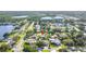 Aerial view of the home located in a suburban neighborhood near a pond at 5925 18Th Ne St, St Petersburg, FL 33703