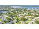 Bird's eye view showcases a neighborhood with a home, lush landscaping, and a neighborhood next to a bay at 5925 18Th Ne St, St Petersburg, FL 33703
