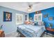 Bright bedroom with a stylish bed and lots of natural light from the shuttered windows at 5925 18Th Ne St, St Petersburg, FL 33703