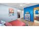Bright bedroom with a flamingo themed painting and a closet at 5925 18Th Ne St, St Petersburg, FL 33703
