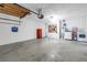 Spacious garage with peg board and fridge; washer dryer; overhead storage at 5925 18Th Ne St, St Petersburg, FL 33703