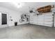 Clean garage space with door, a bicycle, and ceiling storage at 5925 18Th Ne St, St Petersburg, FL 33703