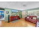 Comfortable living room with a large window and plush seating at 5925 18Th Ne St, St Petersburg, FL 33703