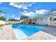 Beautifully maintained backyard pool and patio area with a covered lanai, ideal for outdoor enjoyment at 5925 18Th Ne St, St Petersburg, FL 33703