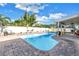 Refreshing backyard pool with brick-paved area featuring plenty of space for outdoor furniture and entertainment at 5925 18Th Ne St, St Petersburg, FL 33703