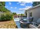 Cozy backyard with pool views, patio seating, landscaping, and room to relax at 5968 46Th N Ave, Kenneth City, FL 33709