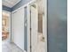 Hallway shot looking into the bathroom featuring a shower-tub combination at 5968 46Th N Ave, Kenneth City, FL 33709