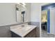 Bathroom with modern vanity, fixtures, and gray tiled accents at 5968 46Th N Ave, Kenneth City, FL 33709