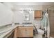 Bathroom featuring countertop, bath with shower, and updated fixtures at 5968 46Th N Ave, Kenneth City, FL 33709
