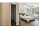 Bedroom featuring laminate floors, ceiling fan, and full closet view at 5968 46Th N Ave, Kenneth City, FL 33709