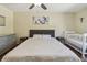 Bedroom with space, with laminate floors, ceiling fan, and crib at 5968 46Th N Ave, Kenneth City, FL 33709