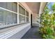 Charming home entrance with decorative brickwork, lush foliage and a covered porch at 5968 46Th N Ave, Kenneth City, FL 33709