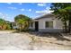 Inviting single-story house with a large driveway and mature trees in a nice neighborhood at 5968 46Th N Ave, Kenneth City, FL 33709
