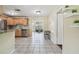 Bright, open kitchen with stainless steel appliances and a view of the living room area at 5968 46Th N Ave, Kenneth City, FL 33709