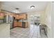 Bright kitchen with lots of natural light, stainless steel appliances, and an open layout to the living room at 5968 46Th N Ave, Kenneth City, FL 33709