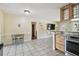 Open floor plan combining the kitchen and dining area perfect for entertaining guests at 5968 46Th N Ave, Kenneth City, FL 33709