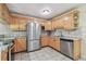 Bright kitchen features stainless steel appliances, marble countertops, and ample cabinet space at 5968 46Th N Ave, Kenneth City, FL 33709