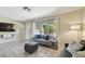 Bright living room features neutral paint, tile floors, and natural light at 5968 46Th N Ave, Kenneth City, FL 33709