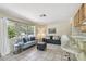 Bright living area featuring tile floors, natural light, and comfortable seating at 5968 46Th N Ave, Kenneth City, FL 33709