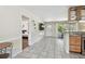 Open living area and entrance, featuring tiled floors and access to a bedroom at 5968 46Th N Ave, Kenneth City, FL 33709