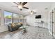 Sunroom features hardwood flooring, multiple windows and fans to let in the natural light and airflow at 5968 46Th N Ave, Kenneth City, FL 33709