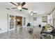 Sunroom features hardwood flooring, multiple windows and fans to let in the natural light and airflow at 5968 46Th N Ave, Kenneth City, FL 33709