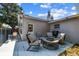 Outdoor patio featuring comfortable seating, a grill, and a fire pit for entertaining and relaxation at 5968 46Th N Ave, Kenneth City, FL 33709