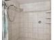 Tiled shower with dual shower heads and built-in shelving for added convenience at 5968 46Th N Ave, Kenneth City, FL 33709
