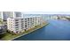 Daytime view of waterfront condo building offering beautiful bay views at 6075 Shore S Blvd # 215, Gulfport, FL 33707