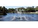 Pond with fountain, lush greenery, and serene setting, perfect for relaxation and enjoying nature at 6075 Shore S Blvd # 215, Gulfport, FL 33707
